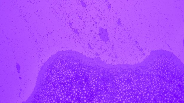 Close-up view of abstract purple bubbles forming a textured background.