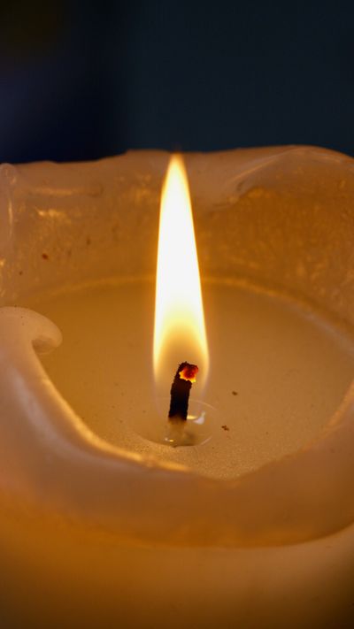 Soy candle flame close up — photo by Artem Podrez on Pexels