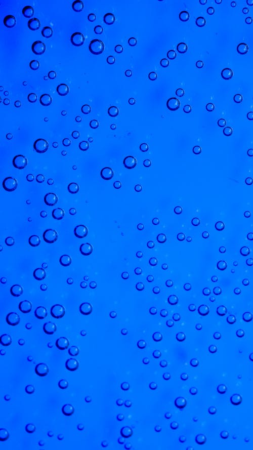 Water Droplets on Blue Background