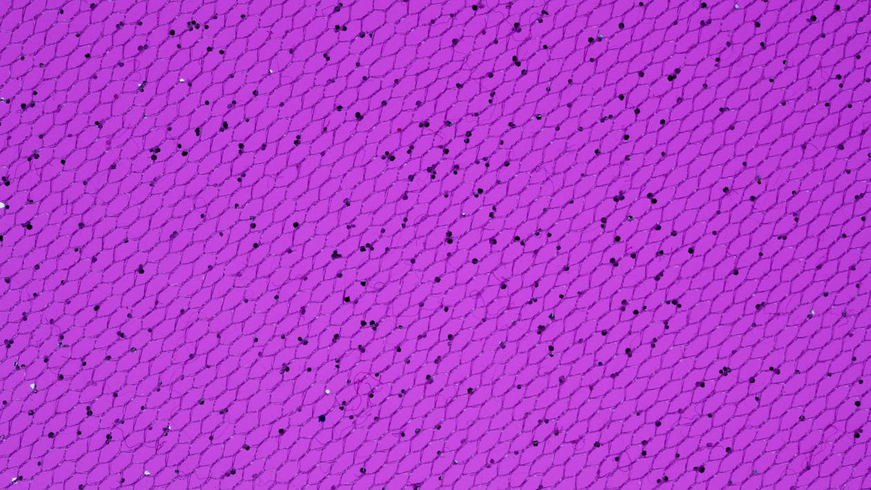 Photo of a Purple Surface with Black Spots