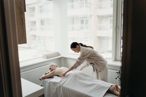 A Massage Therapist and a Woman