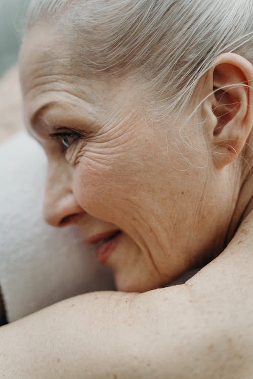 Close-Up Photograph of an Elderly Woman with Freckles