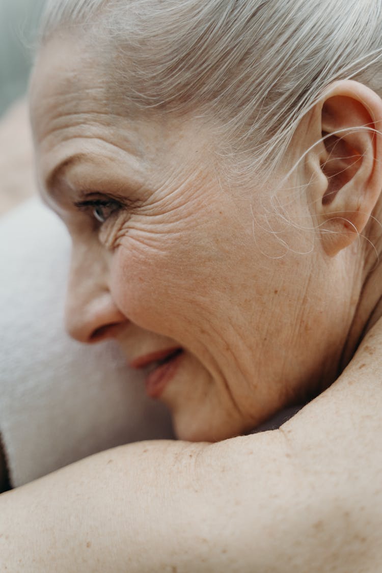 Close-Up Photograph Of An Elderly Woman With Freckles