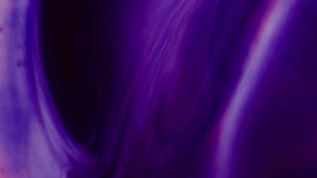 An abstract image showcasing a purple and violet fluid swirl, perfect for vibrant backgrounds or art displays.