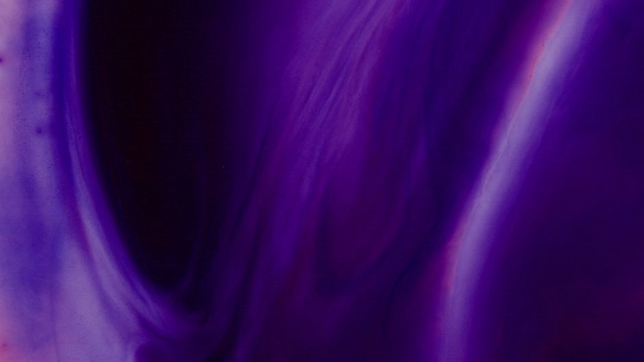 An abstract image showcasing a purple and violet fluid swirl, perfect for vibrant backgrounds or art displays.