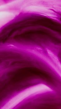 Dynamic abstract art with bold purple swirls creating a captivating visual texture.