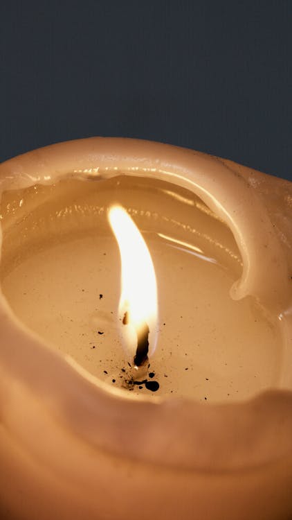 Close-Up Photo of a Lit Candle