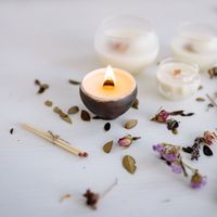 SaltAndCedarCandles shop icon: hand-poured candle with dried botanicals — Yan Krukau on Pexels