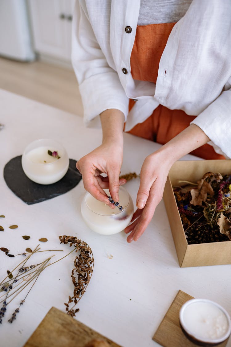 Person Making Artisan Candles