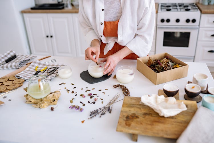 Person Making Artisan Candles