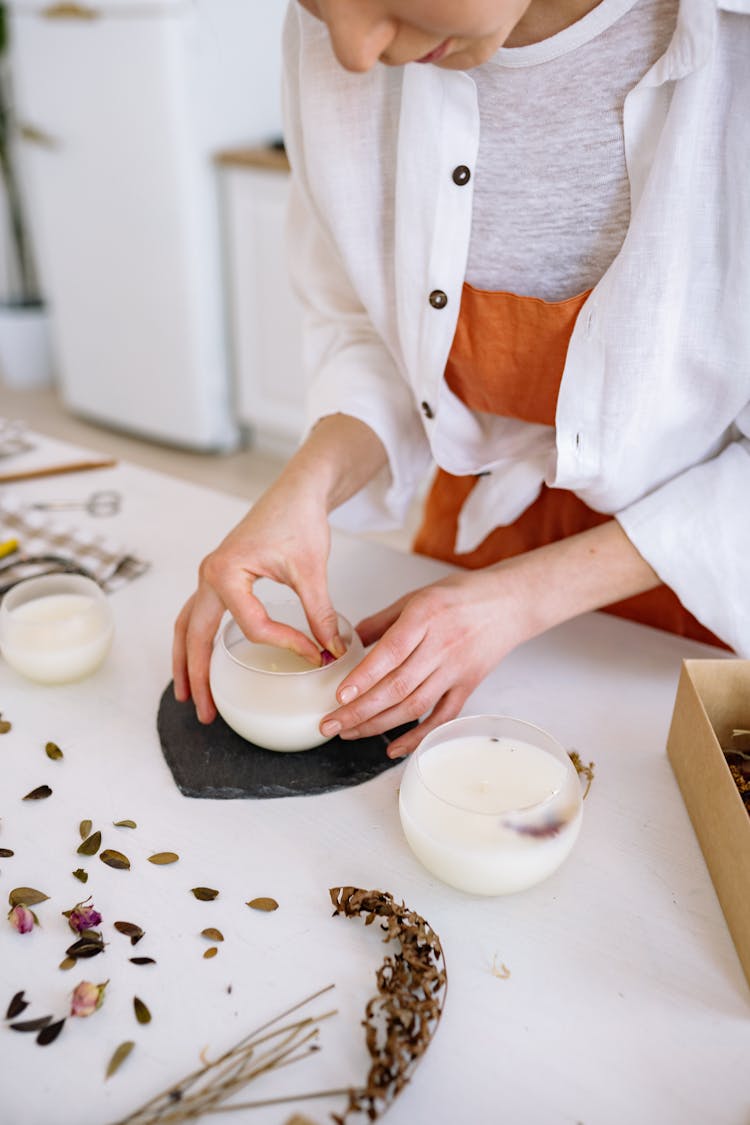 Person Making Artisan Candles