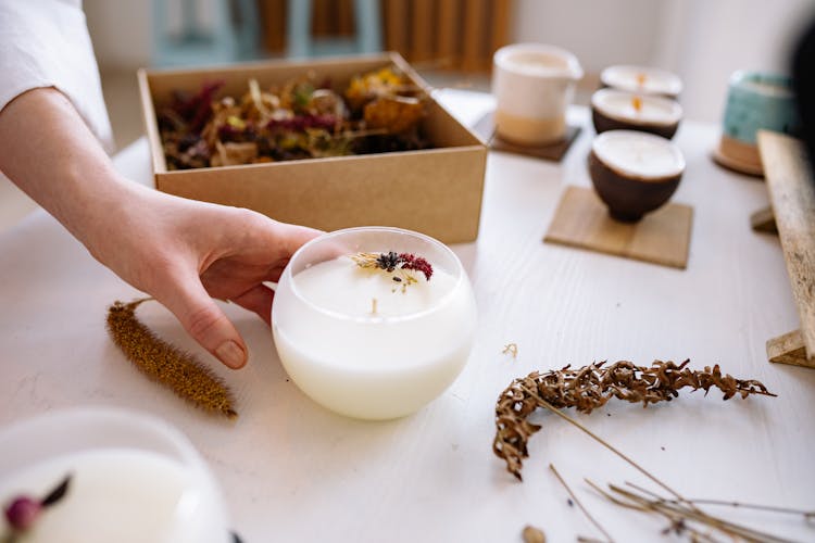 Person Making Artisan Candles