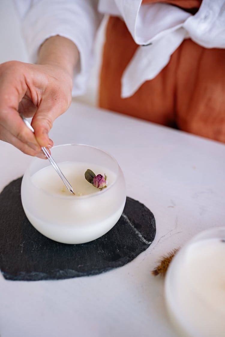 Person Making Artisan Candles