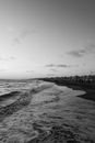 Foamy wavy sea on city shore