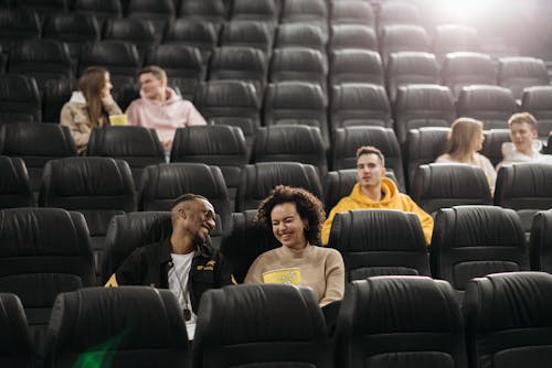 Free People Sitting in Movie Theater Stock Photo