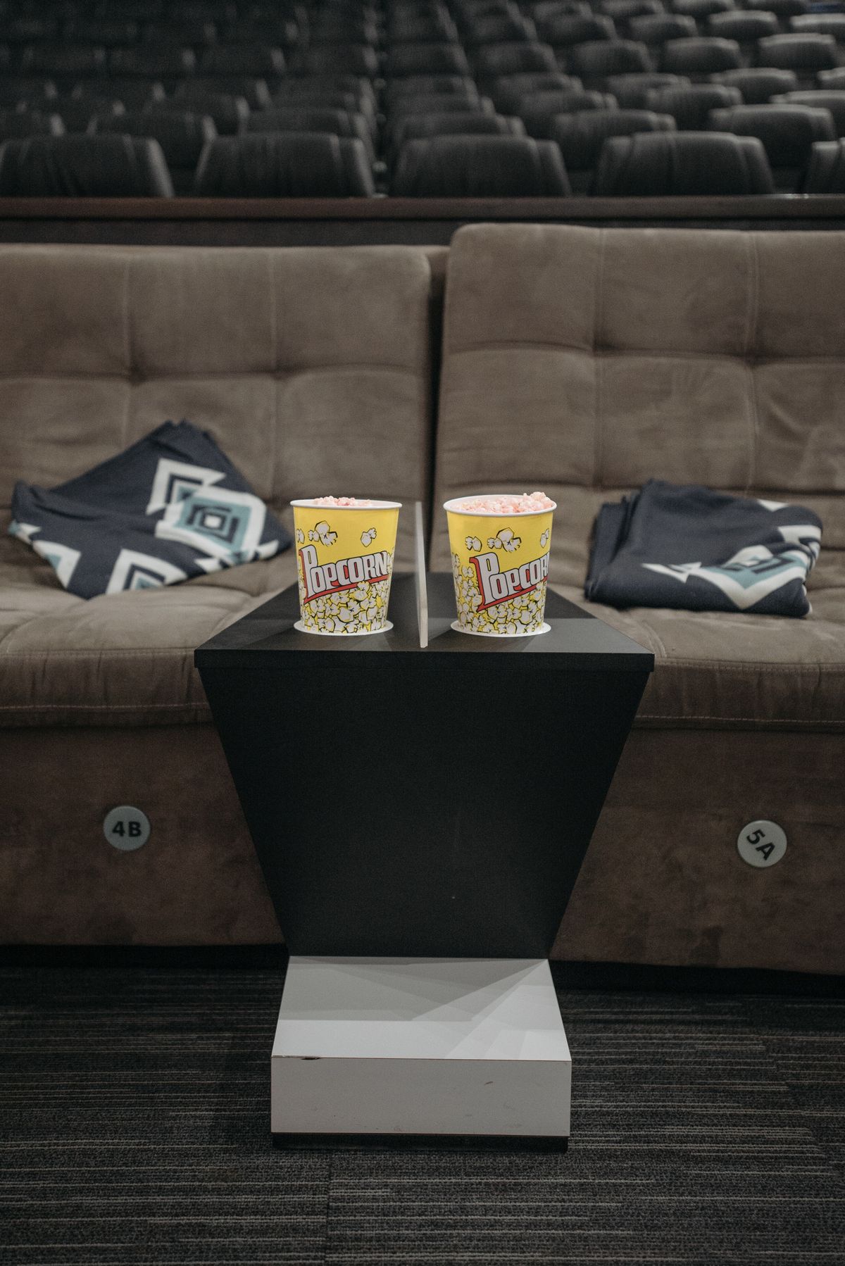 Cinema seating with popcorn for a movie trivia night, trivia night party ideas