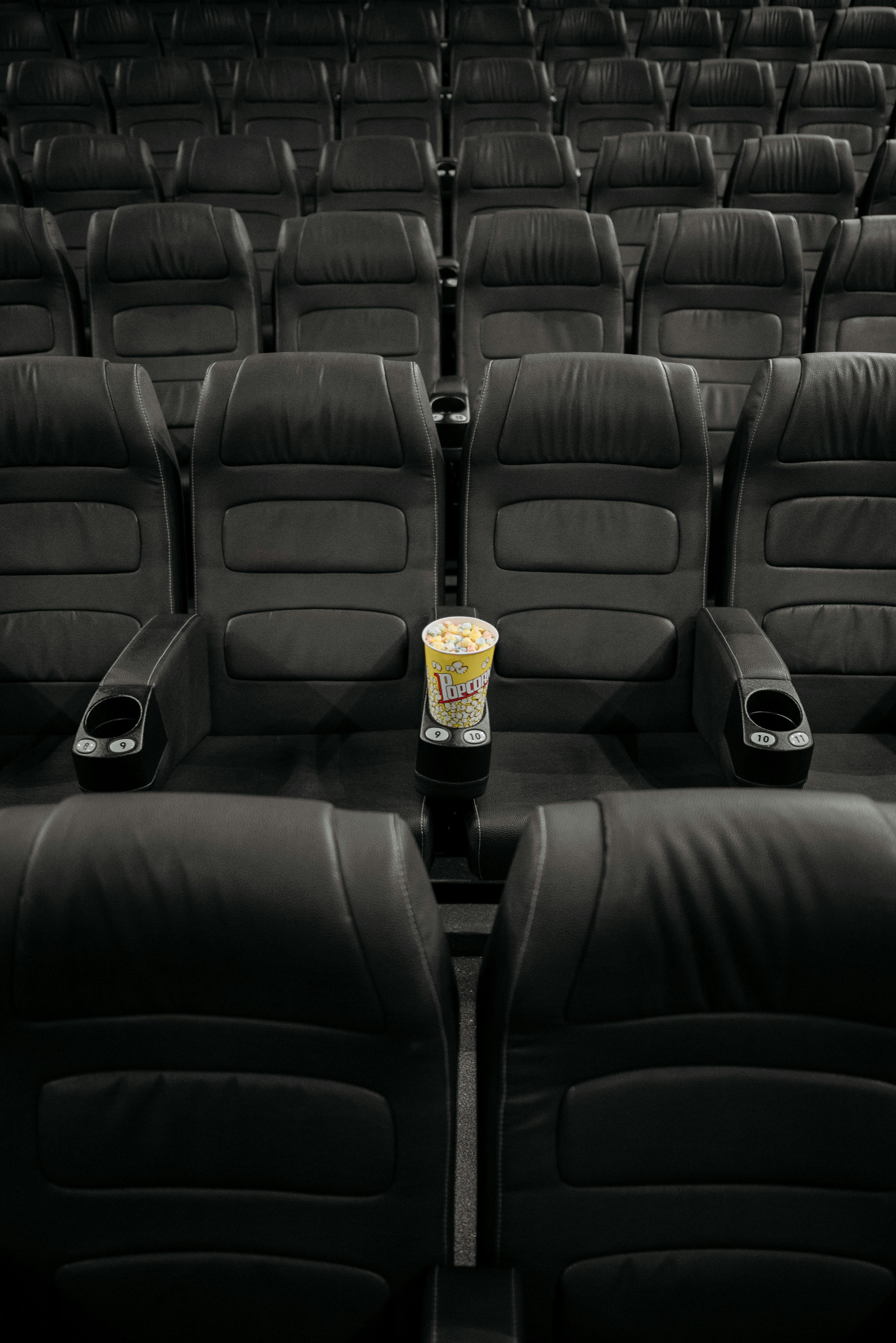 lined up black leather cinema seats