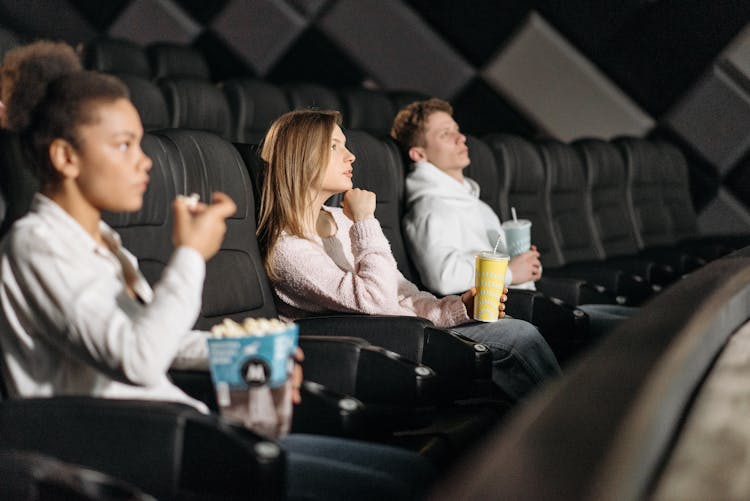 People Watching A Movie In A Cinema