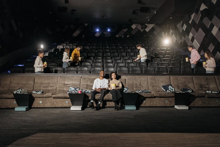 A Couple Sitting On The Cinema Seats