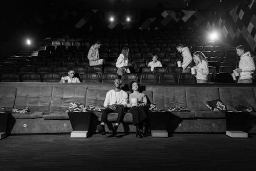 Free Grayscale Photo of People Inside a Movie Theater Stock Photo