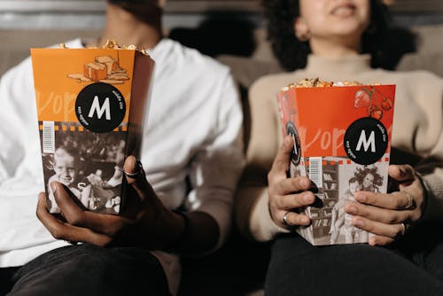 Free Couple Watching in Cinema with Popcorn Stock Photo