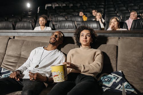 Close-Up Photo of a Couple Watching a Movie Together