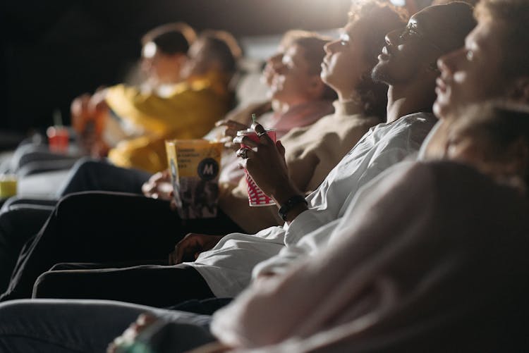 People Watching In The Cinema 