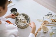 A Person Scooping White Flakes with an Scooper