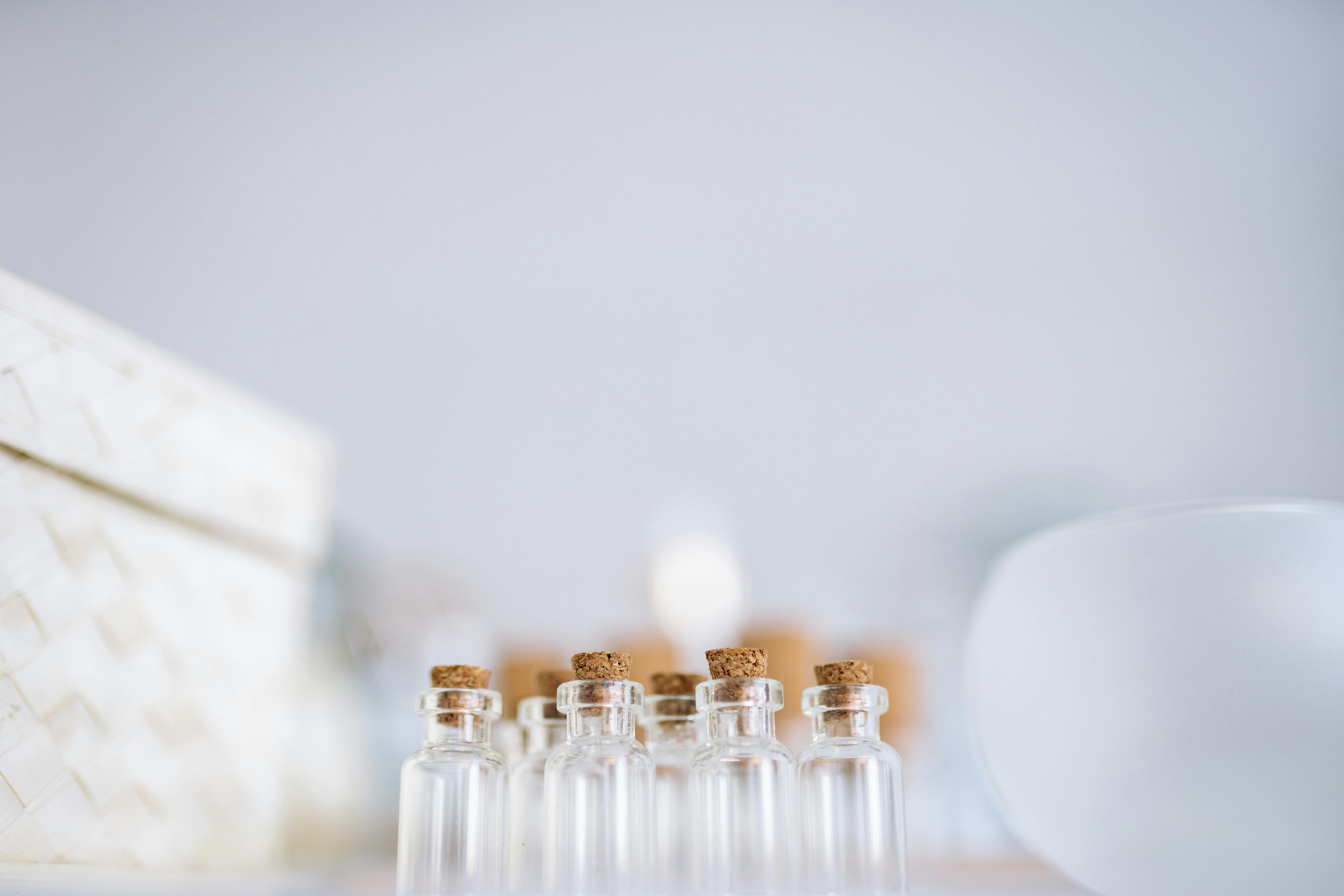 Green Liquid on Clear Glass Bottle With Cork · Free Stock Photo