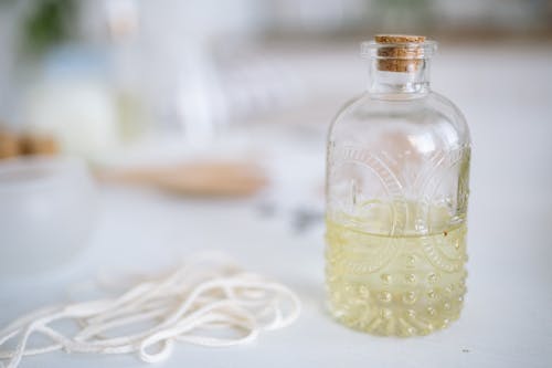 Free Clear Glass Bottle With White String Lights Stock Photo