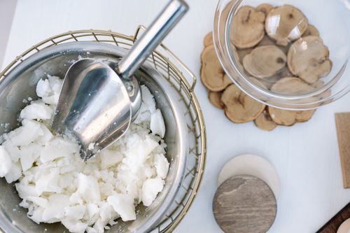 Free Flatlay of candle wax in a stainless steel bowl with a scooper, perfect for DIY projects. Stock Photo