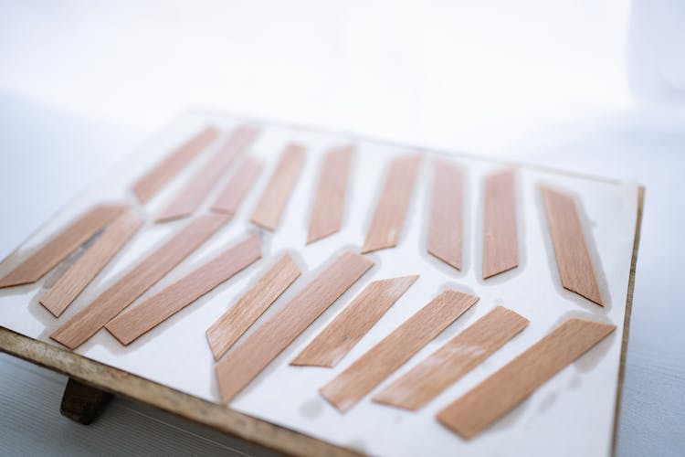 Thin Strips Of Wooden Wicks On White Paper
