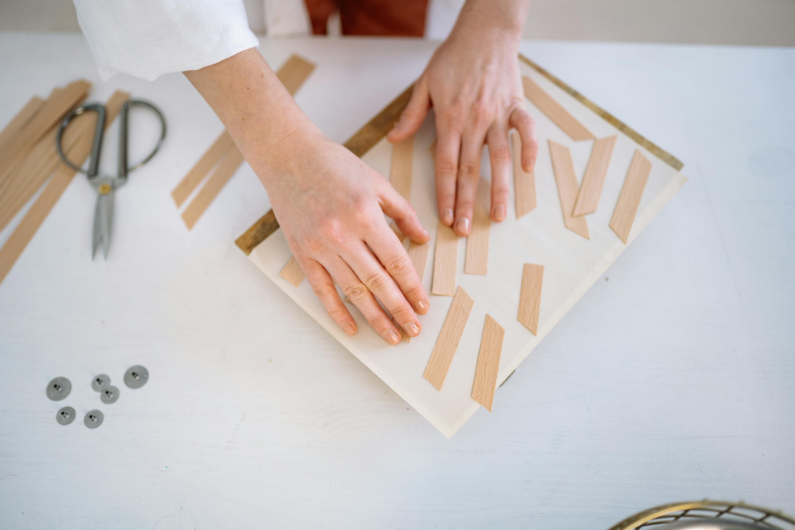Person Holding Brown and White Wooden Blocks · Free Stock Photo