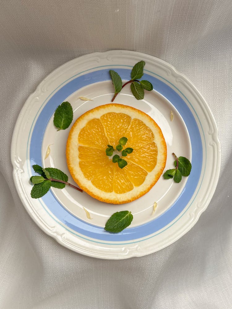 Mint Leaves And A Slice Of Orange