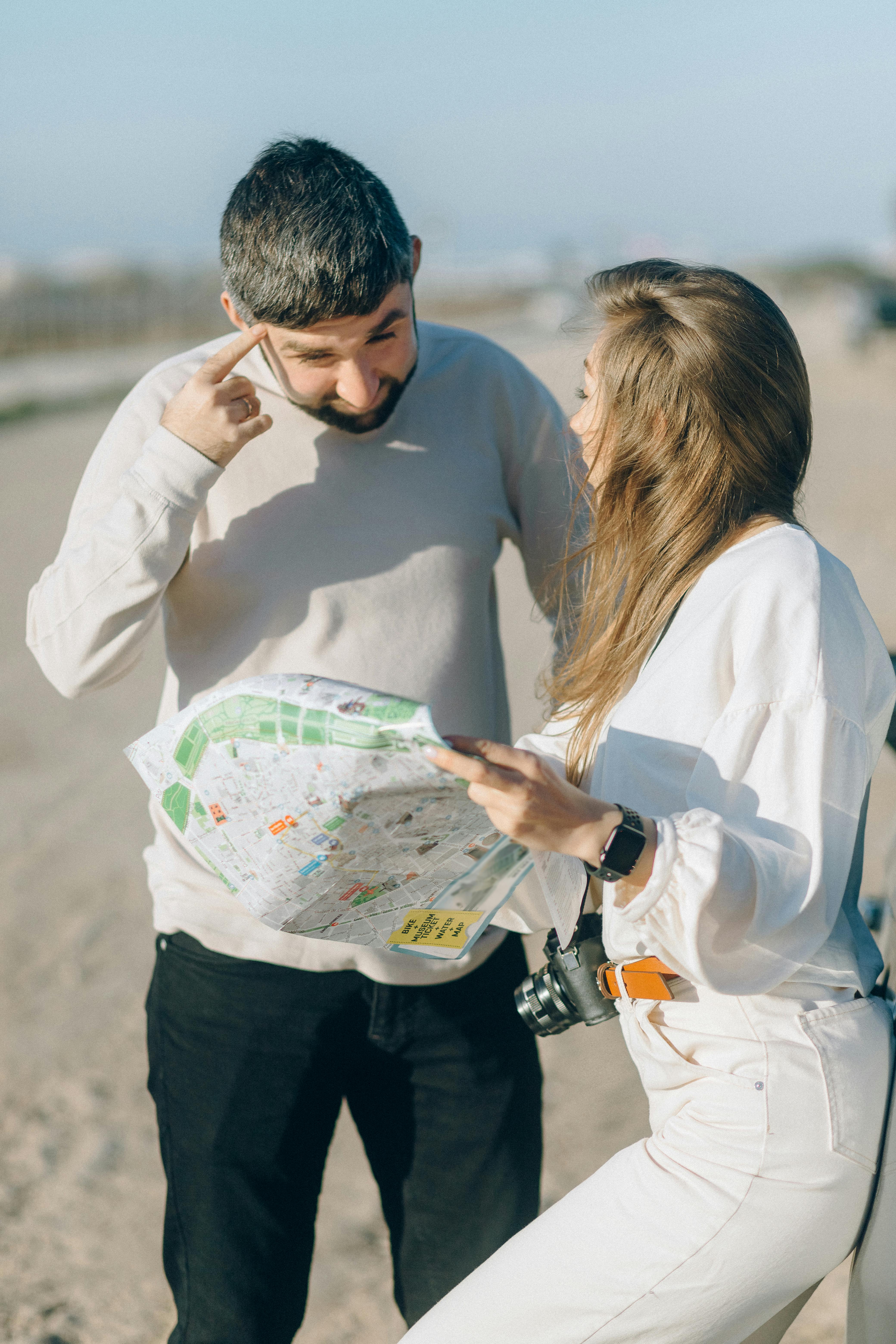 photograph of a woman in white clothes asking for directions