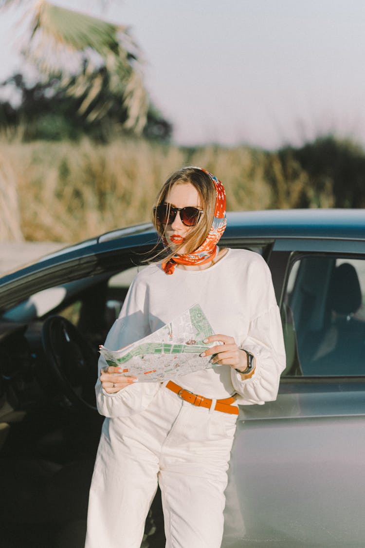 Woman With A Headscarf Holding A Map