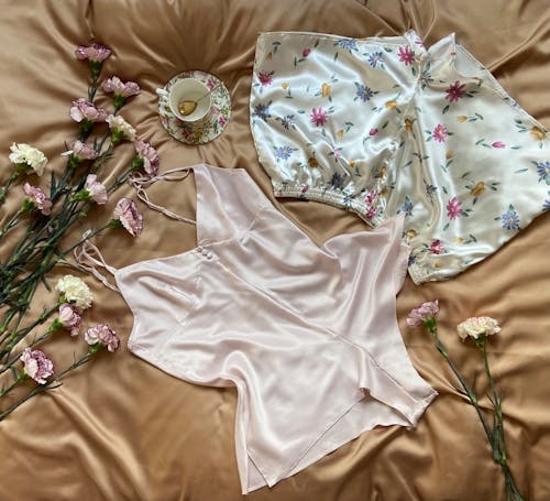 Pajamas with flowers on brown blanket