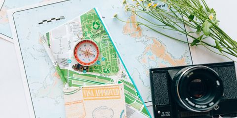 Explore your wanderlust with maps, a compass, and a vintage camera.