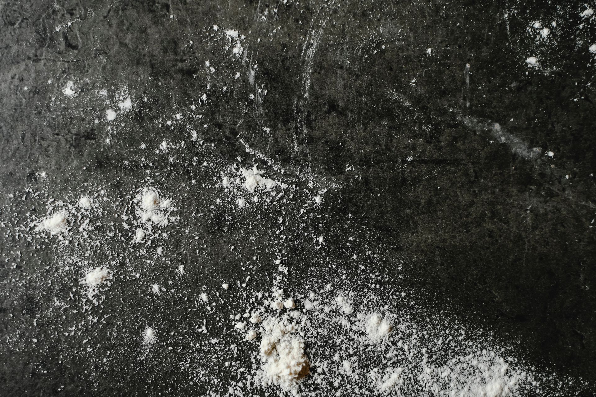 White Powder on Black Surface