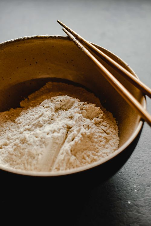 Free Close-up of flour in a bowl with chopsticks, perfect for cooking themes. Stock Photo