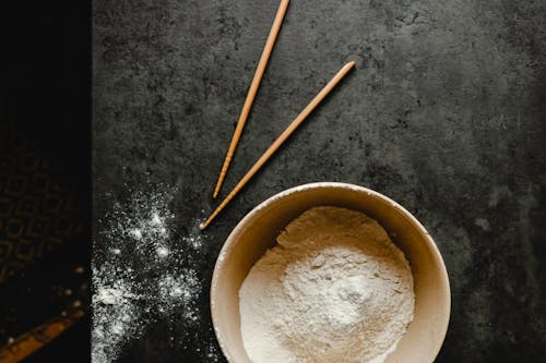 Brown Chopsticks on Black Surface