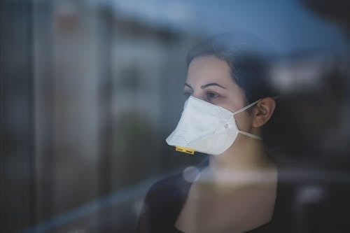 Man in Black Shirt With White Face Mask