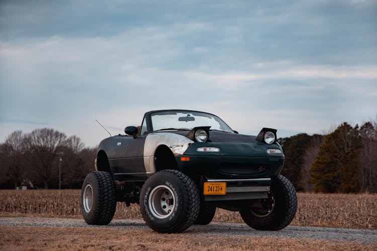 A Parked Car With Big Wheels