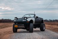 A Car Parked on Dirt Road