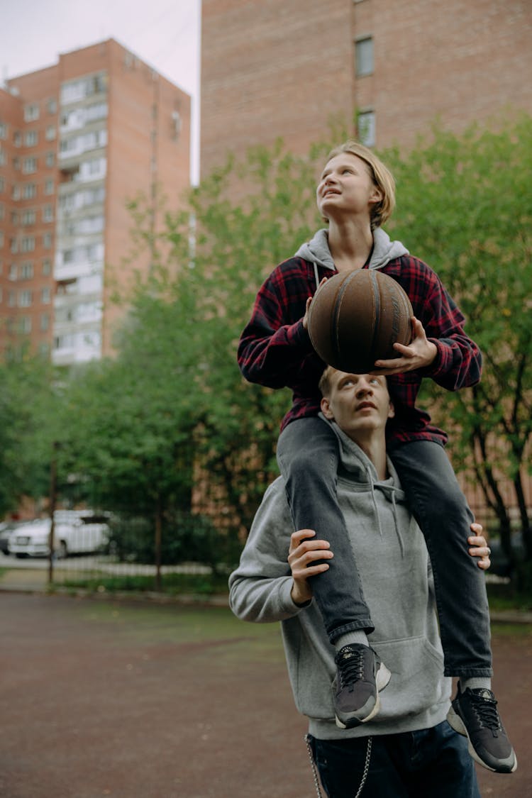 A Two Men Playing Basketball