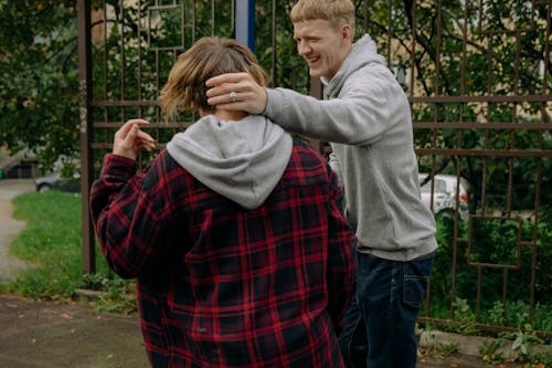 A Man Laughing with his Friend