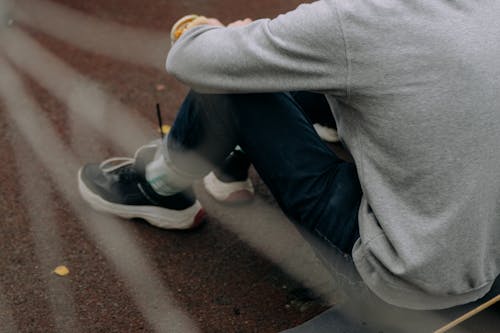 Person Sitting on Ground