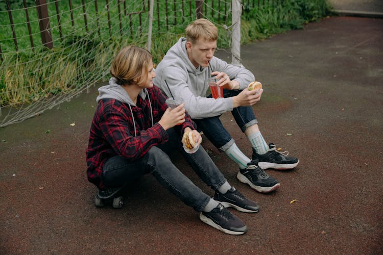 Photograph Of Siblings Eating Together