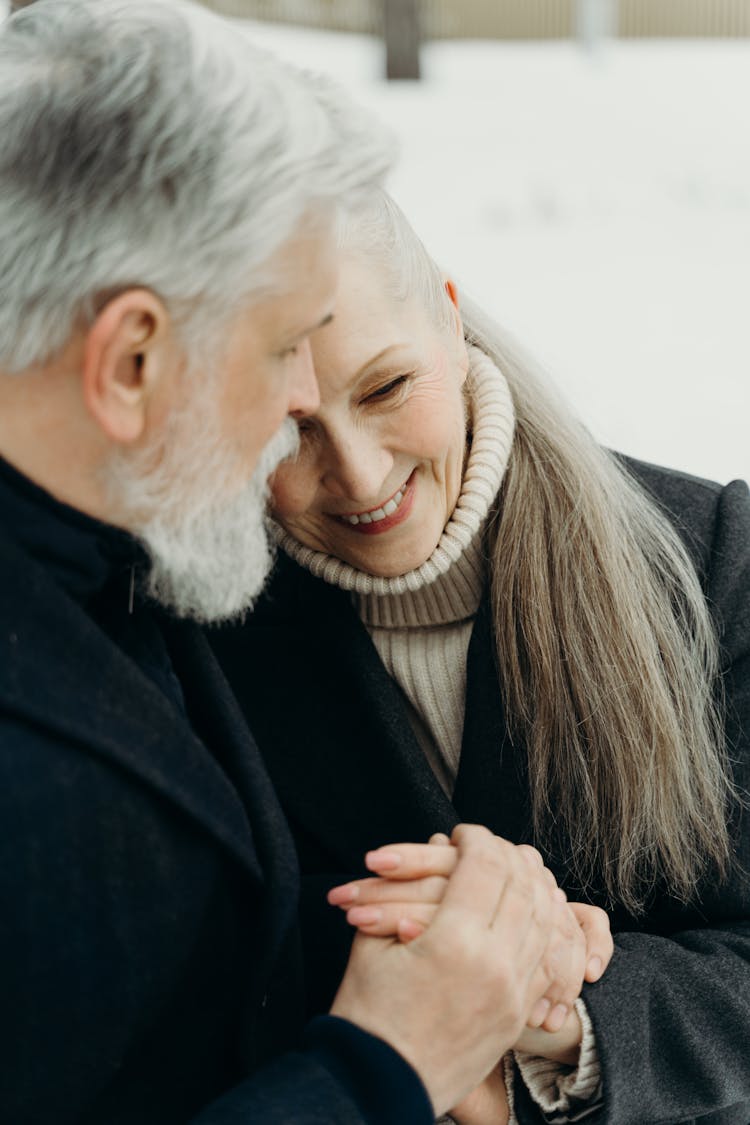 Close-Up Shot Of An Elderly Couple Embracing