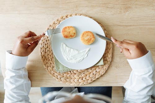 Free A ceramic Plate with Pancakes and Cream Cheese Stock Photo